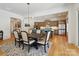 Dining room with a view into a modern kitchen and stainless steel refrigerator at 1009 Belmont Ave, Charlotte, NC 28205