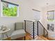 Hallway seating area with large windows and modern decor at 1009 Belmont Ave, Charlotte, NC 28205