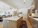 Open kitchen featuring a spacious island with seating, modern cabinetry, and views into the adjacent dining area at 1009 Belmont Ave, Charlotte, NC 28205