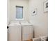 Practical laundry room featuring a side-by-side washer and dryer and minimalist decor at 1009 Belmont Ave, Charlotte, NC 28205