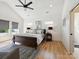 Spacious main bedroom features high ceilings, a ceiling fan, and natural light at 1009 Belmont Ave, Charlotte, NC 28205