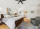 Large main bedroom showcases natural light, high ceilings, and ensuite bathroom at 1009 Belmont Ave, Charlotte, NC 28205