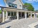 Spacious covered patio featuring ample seating and open views of the backyard pool area at 1009 Belmont Ave, Charlotte, NC 28205