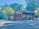 Attractive brick building with outdoor seating, perfect for enjoying the local burger and beer scene at 1009 Belmont Ave, Charlotte, NC 28205