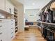 Organized walk-in closet with custom shelving and drawers at 1009 Belmont Ave, Charlotte, NC 28205