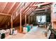 Unfinished attic space featuring exposed wooden beams and plenty of storage at 10209 Thomas Payne Cir, Charlotte, NC 28277