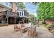 Brick patio features outdoor seating, manicured landscaping, and a charming setting at 10209 Thomas Payne Cir, Charlotte, NC 28277