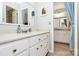 Bathroom featuring dual sinks and vanities with a large mirror at 10209 Thomas Payne Cir, Charlotte, NC 28277