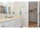 Bathroom with a white vanity and decorative wall art above the toilet at 10209 Thomas Payne Cir, Charlotte, NC 28277