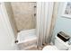 Cozy bathroom featuring a tiled shower and modern toilet at 10209 Thomas Payne Cir, Charlotte, NC 28277
