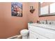 Charming powder room featuring granite countertops and decorative painting at 10209 Thomas Payne Cir, Charlotte, NC 28277