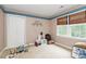 Bedroom with a large window, neutral colors, and carpet at 10209 Thomas Payne Cir, Charlotte, NC 28277