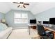 Bedroom with a ceiling fan, desk, and comfortable seating at 10209 Thomas Payne Cir, Charlotte, NC 28277