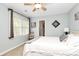 Bedroom with natural light, ceiling fan, and neutral carpeting at 10209 Thomas Payne Cir, Charlotte, NC 28277