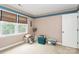 Bedroom with a large window, neutral colors, and carpet at 10209 Thomas Payne Cir, Charlotte, NC 28277