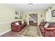 Warm living room showcasing hardwood floors, comfortable seating, and a welcoming ambiance at 10209 Thomas Payne Cir, Charlotte, NC 28277