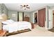 Main bedroom featuring a neutral color palette, a ceiling fan, and a walk-in closet at 10209 Thomas Payne Cir, Charlotte, NC 28277