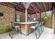 Outdoor bar on a patio with seating is perfect for entertaining guest at 10209 Thomas Payne Cir, Charlotte, NC 28277
