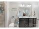 Bathroom featuring a vanity with double sinks and a stand up shower at 10436 Dalton Woods Nw Ct, Huntersville, NC 28078