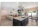 Open kitchen with stainless steel appliances, granite countertops, and pot rack at 10436 Dalton Woods Nw Ct, Huntersville, NC 28078
