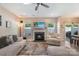 Comfortable living room featuring a fireplace, TV, large rug and sliding door to outside at 10436 Dalton Woods Nw Ct, Huntersville, NC 28078
