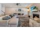 Comfortable living room with a fireplace, tv, large area rug and lots of seating at 10436 Dalton Woods Nw Ct, Huntersville, NC 28078