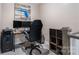 Cozy office space featuring modern computer setup, sleek black filing cabinet, and stylish decorative wall art at 10436 Dalton Woods Nw Ct, Huntersville, NC 28078