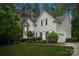 Two-story home with white siding, black shutters, and a well-maintained lawn, complemented by mature trees at 109 Braxton Gate Ct, Mount Holly, NC 28120