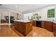Bright kitchen showcasing a large island with seating, hardwood floors, and an open layout at 109 Braxton Gate Ct, Mount Holly, NC 28120