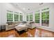 Cozy living room with hardwood floors, a comfortable sectional sofa, and lots of natural light at 109 Braxton Gate Ct, Mount Holly, NC 28120