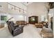 Spacious living room features a stone fireplace, high ceilings, and a balcony overlooking the space at 109 Braxton Gate Ct, Mount Holly, NC 28120