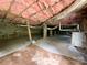 View of a basement with exposed wooden beams, insulated ceiling, and water heater at 1105 S Church S St, Monroe, NC 28112