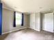 Bedroom featuring neutral walls, a window, and carpeted floors at 1105 S Church S St, Monroe, NC 28112