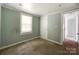 Bedroom with neutral walls, a window, and carpeted floors offering a serene atmosphere at 1105 S Church S St, Monroe, NC 28112