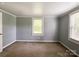 Bedroom featuring neutral walls, a window, and carpeted floors at 1105 S Church S St, Monroe, NC 28112