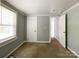 Bedroom with neutral walls, a window, and carpeted floors, providing a comfortable space at 1105 S Church S St, Monroe, NC 28112
