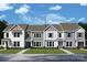 Charming new construction townhome with varied siding and a well-manicured lawn at 11453 Prosperity Church Rd, Huntersville, NC 28078