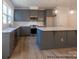 New kitchen with gray cabinets, modern countertops, island and stainless steel appliances at 11453 Prosperity Church Rd, Huntersville, NC 28078