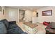 Finished basement with a comfortable seating area, a decorative coffee table, and easy access to stairs at 11741 Blessington Rd, Huntersville, NC 28078