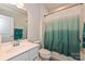 Clean bathroom with a single vanity, a shower with a curtain, and towel racks for convenience at 11741 Blessington Rd, Huntersville, NC 28078
