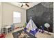 Playful bedroom with a chalkboard wall, teepee, and ample space for activities and toys at 11741 Blessington Rd, Huntersville, NC 28078