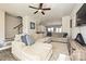 Comfortable living room with a large sectional sofa, ceiling fan, and easy access to the kitchen and dining area at 11741 Blessington Rd, Huntersville, NC 28078