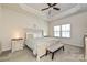 Serene main bedroom with a tray ceiling, ceiling fan, and ample natural light from the double windows at 11741 Blessington Rd, Huntersville, NC 28078