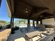 Community outdoor picnic area under a covered structure with ceiling fans and a view of the pool at 11741 Blessington Rd, Huntersville, NC 28078