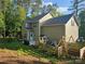 Backyard of the house featuring a patio, playhouse, swing, and fenced-in garden at 1200 Kent Dr, Lancaster, SC 29720