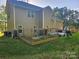 Backyard featuring a fenced garden, grill, and part of the house with light brown siding at 1200 Kent Dr, Lancaster, SC 29720