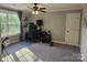 Bright bedroom featuring a ceiling fan and a large window letting in plenty of natural light at 1200 Kent Dr, Lancaster, SC 29720