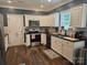 The kitchen showcases white cabinets, granite countertops, and stainless steel appliances for cooking convenience at 1200 Kent Dr, Lancaster, SC 29720