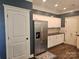 Well-lit kitchen features white cabinets, stainless steel appliances, and a stylish backsplash for a modern look at 1200 Kent Dr, Lancaster, SC 29720