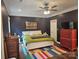 Comfortable main bedroom with hard wood flooring, a colorful rug, and vibrant artwork at 1200 Kent Dr, Lancaster, SC 29720
